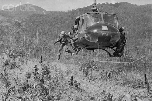 American Soldiers Jumping from Helicopter in South Vietnam